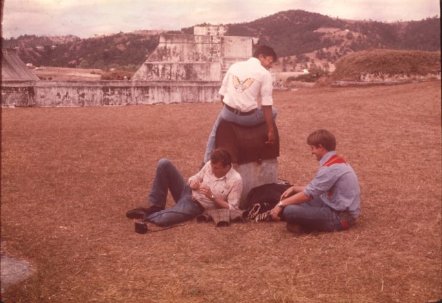 At Zaculeu, February 2, 1976. Elders Robbins, Argueta, and Howard. Elder Argueta is displaying the embroidered butterfly on the back of his shirt.