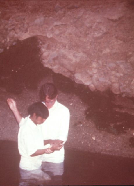 Elder Taz Evans baptizing Rigoberto Miza