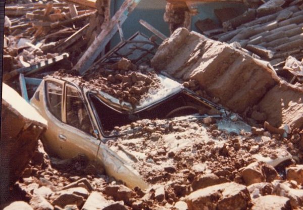 Car crushed by the weight of the adobe walls.